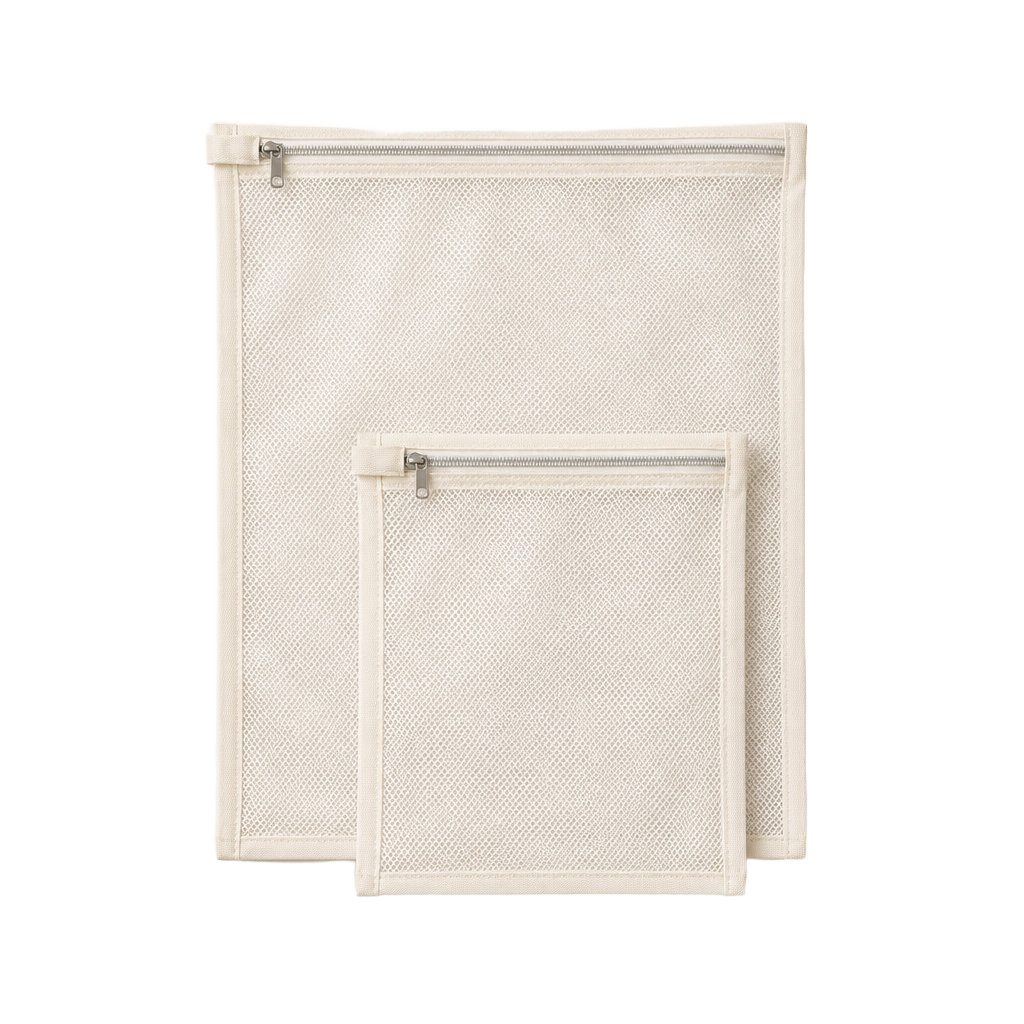 Set of two ivory mesh wash bags, one large and one small, with zippers