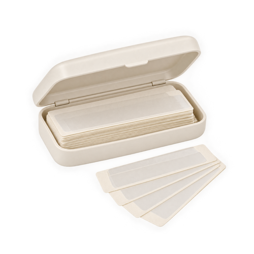 Double-sided body tape travel kit with pre-cut strips in a small ivory case