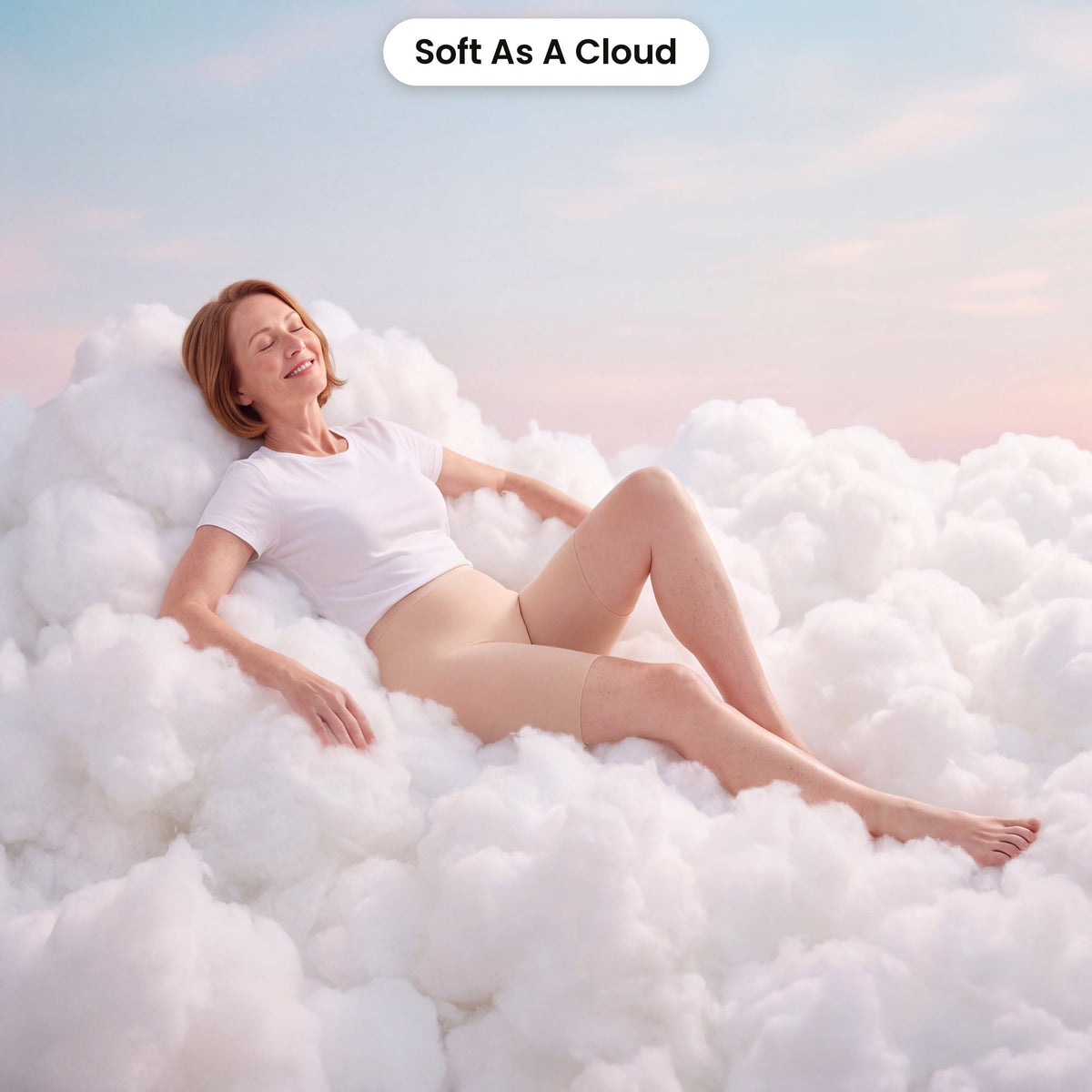 Woman relaxing on clouds in FrostKnit Invisible Boxer Shorts, soft as a cloud