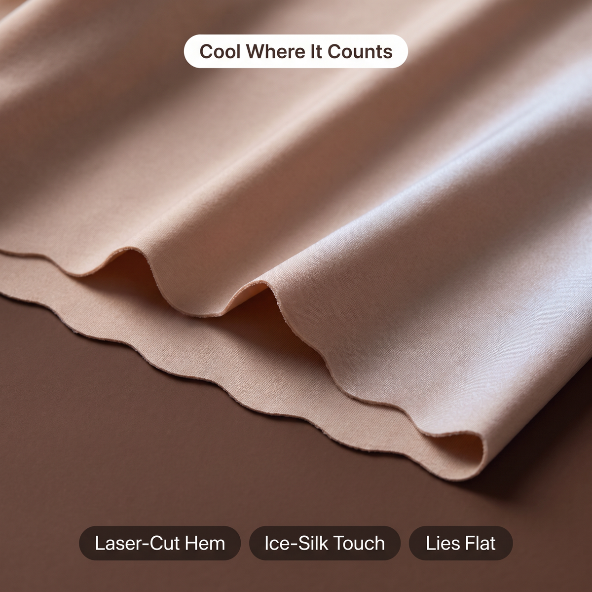 Close-up of the laser-cut scalloped hem and ice-silk fabric