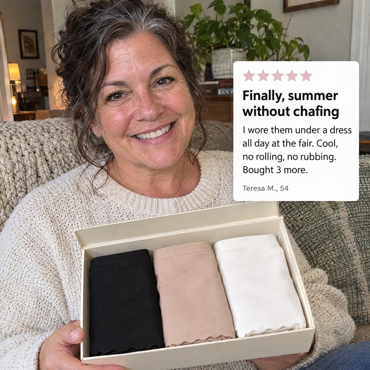 Woman holding a box of three panties with a review