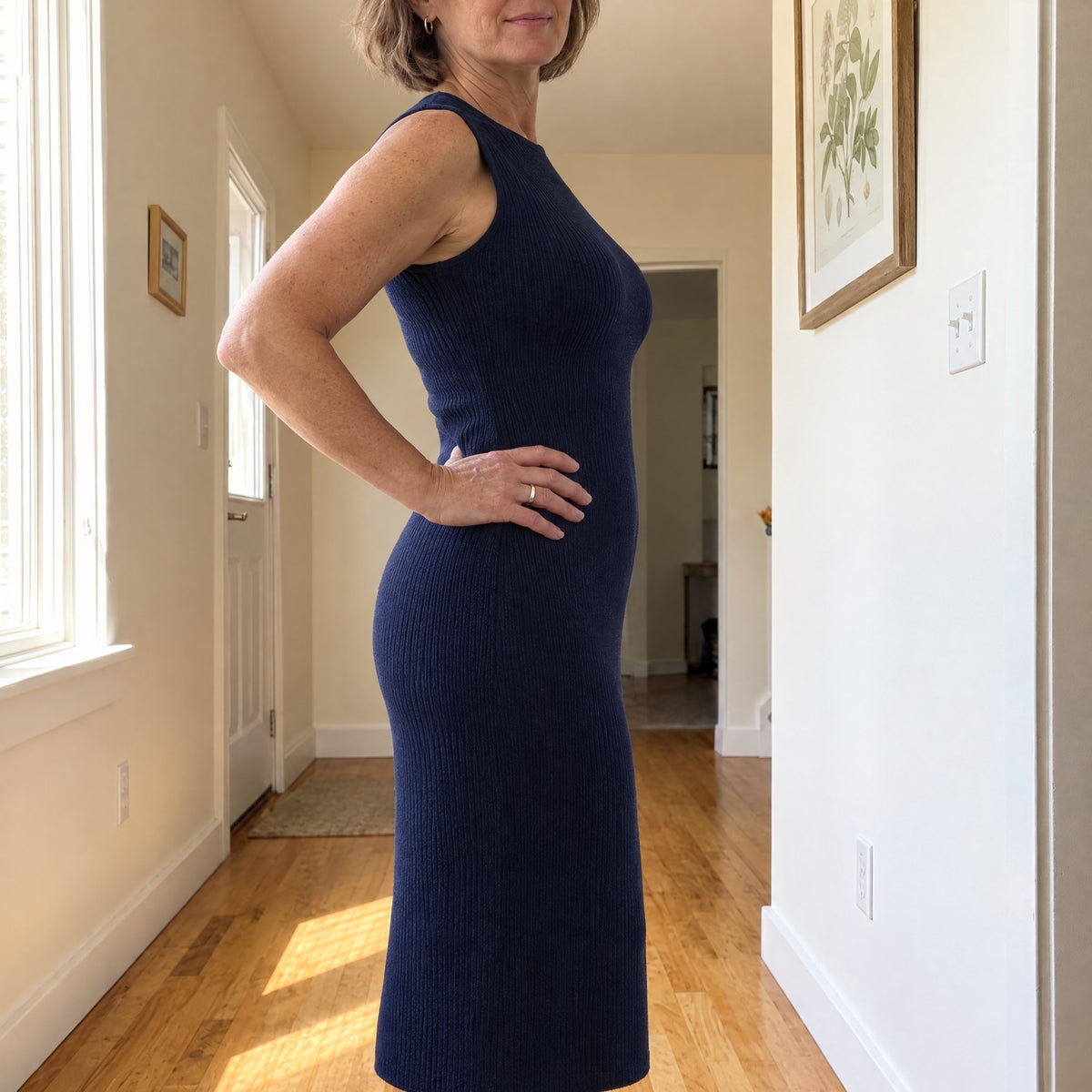 Smooth under a fitted navy dress: no lines, no bumps